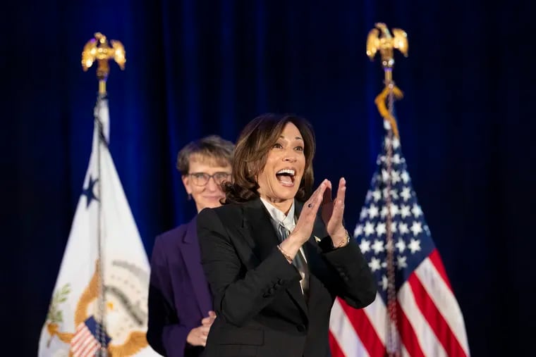 Vice President Kamala Harris smiles as she is welcome on Tuesday during a moderated conversation with the international executive board for SEIU, the service employees union in Philadelphia.