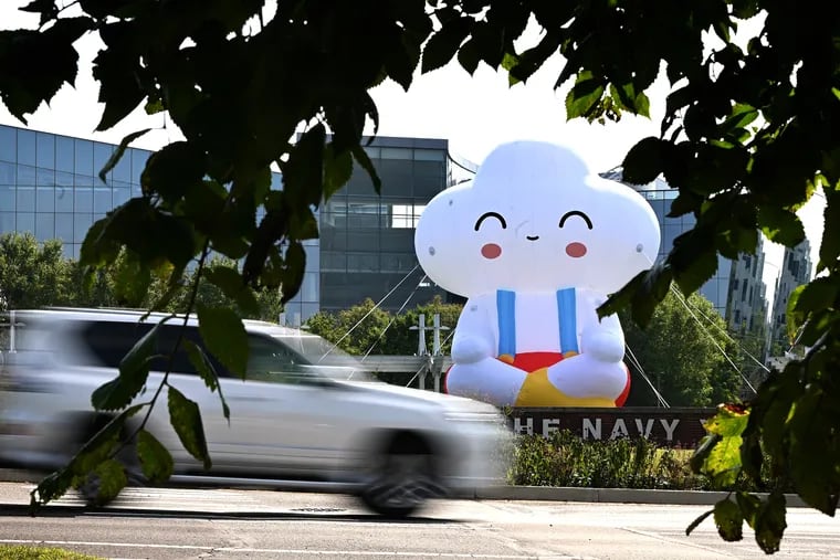 A 35-foot inflatable named "Seated Little Cloud"  is positioned at the South Broad Street entrance to the Navy Yard. The installation was created by LA-based artists Samuel Borkson and Arturo Sandoval III. Its placement is a part of Navy Yard's annual public art installation, which is curated by Philly collective Group X.