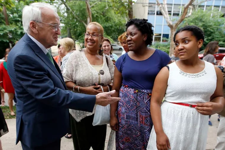 Kevin Concannon of the USDA talks to Clark Park Farmers Market regulars and West Phila. residents Denise Brice (second from left), Joanne Browley, and her daughter, Camryn Pearson. Concannon announced the SNAP expansion to include more farmers and markets.