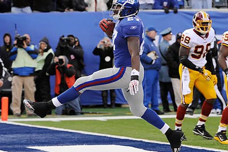 The Giants steamrolled the Washington Redskins, 31-7, on Sunday at the new Meadowlands Stadium. (Bill Kostroun/AP)