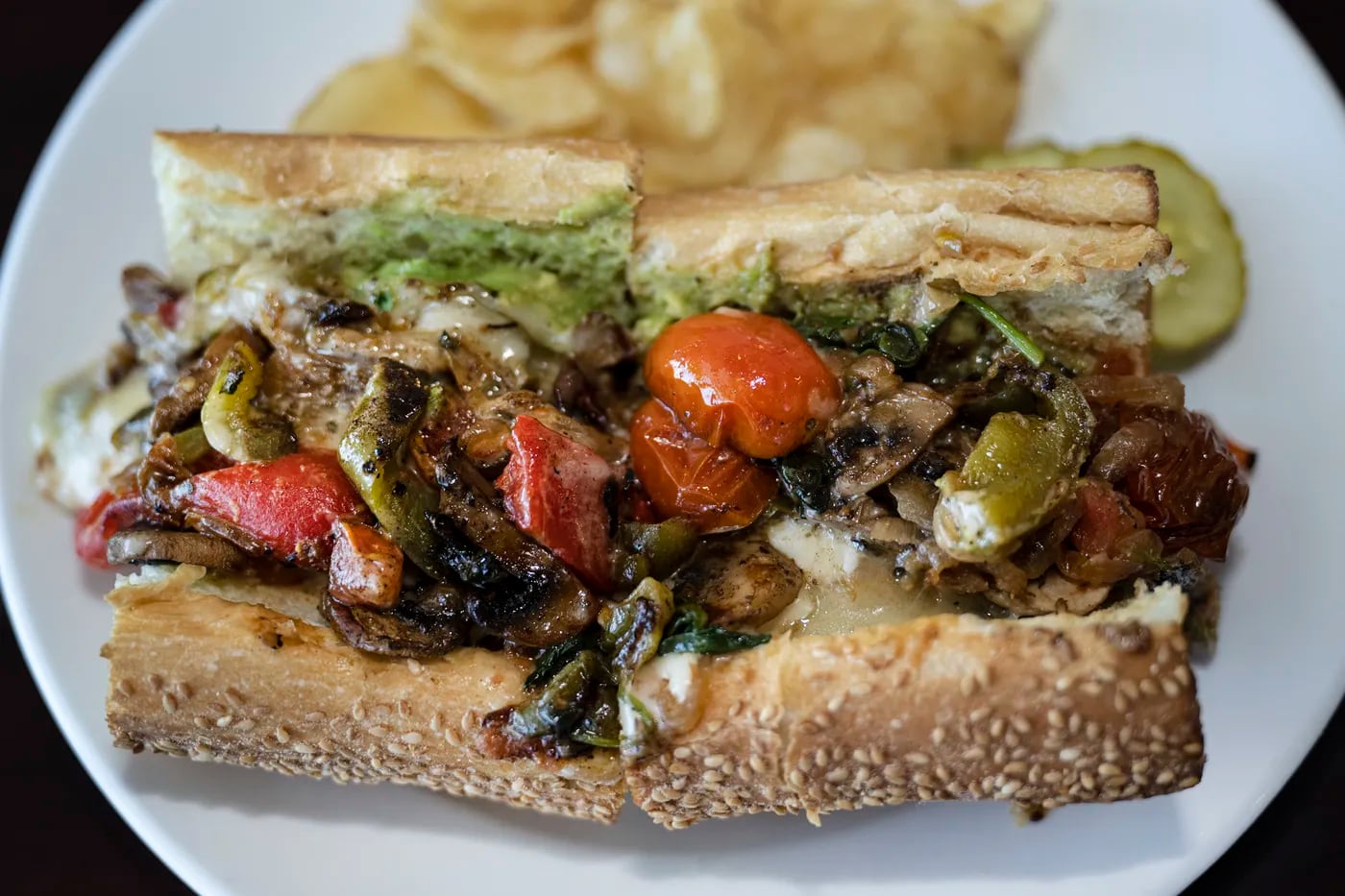 The Vex’ahlia is a pile-it-on vegetarian fantasia of roasted peppers, onions, mixed mushrooms, and marinated tomatoes at Queen Bean Bistro.