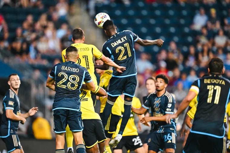 Danley Jean Jacques (center) goes up for a header during the first half of the Union's loss to Columbus.