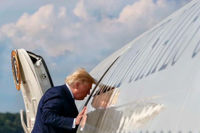 President Donald Trump boards Air Force One, Friday, Aug. 2, 2019, at Andrews Air Force Base, Md., en route to New Jersey. (AP Photo/Jacquelyn Martin)