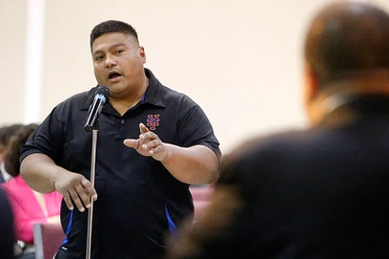 Cherry Hill resident Israel Serrano voices his opposition to open Charter School in Cherry Hill during the Q&A session. (Akira Suwa / Staff Photographer )