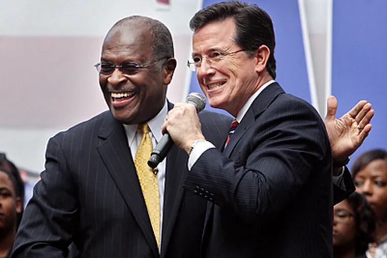 Comedian Stephen Colbert (right) with Herman Cain at the non-rally rally. (Grace Beahm / Post and Courier)