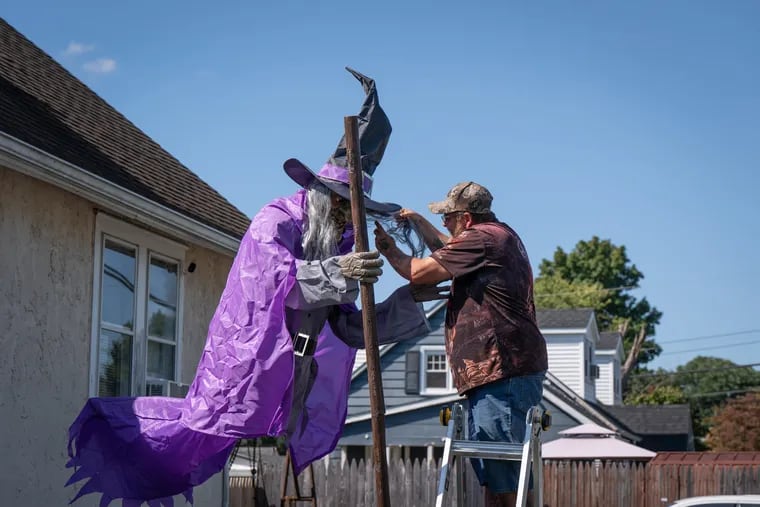 Bruce Higgins installs elaborate Halloween decorations at his house in Croydon, PA. Higgins decorates for Halloween and Christmas, today he was making a spider web. He makes many of his decorations himself.