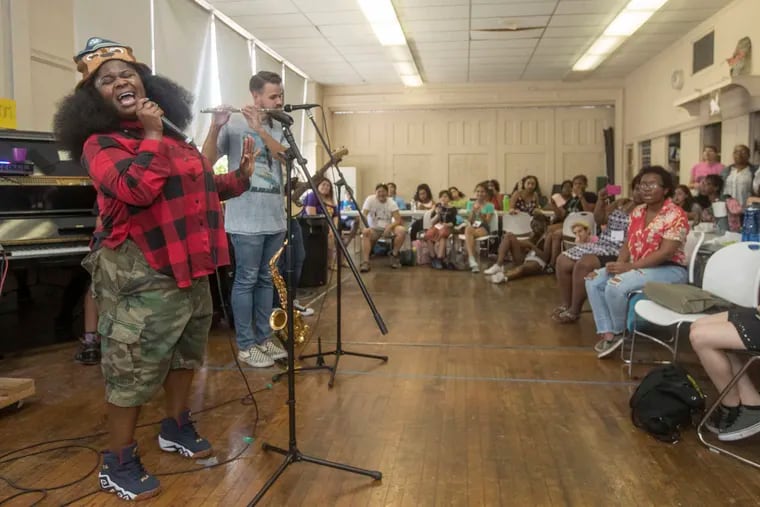 Tarriona "Tank" Ball belts out a lyric as she and her band, Tank and the Bangas, perform for the campers at Girls Rock Philly camp in 2017. Michael Bryant / File Photograph