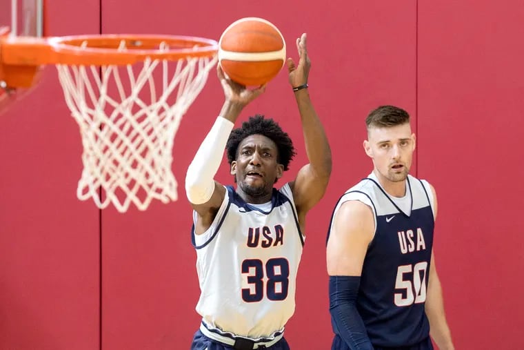 Langston Galloway shoots as Micah Potter looks on during training camp Team USA in July.