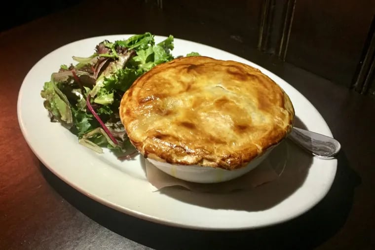 The new seafood pot pie at the Good Dog Bar hides scallops, shrimp and market fish beneath its flaky puff pastry crust.