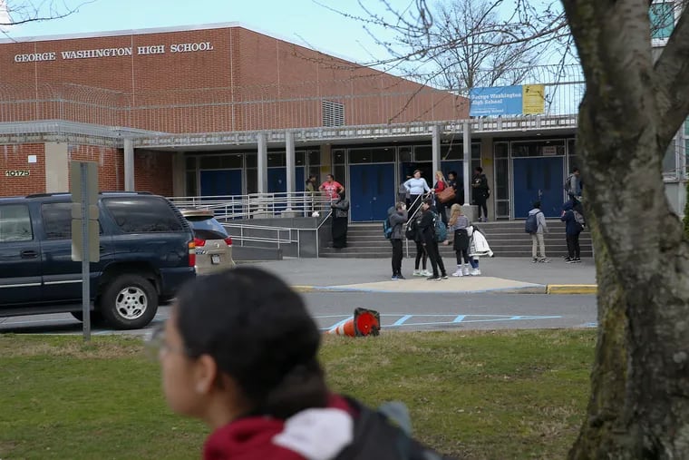 Students leave George Washington High School in Northeast Philadelphia after dismissal on Friday, March 13, 2020. Philadelphia public schools will be closed for at least two weeks from that date, Superintendent William Hite announced Friday.