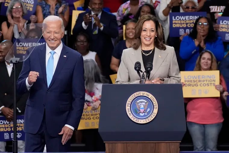 President Joe Biden, left, and Vice President Kamala Harris speak in Largo, Md., on Aug. 15.