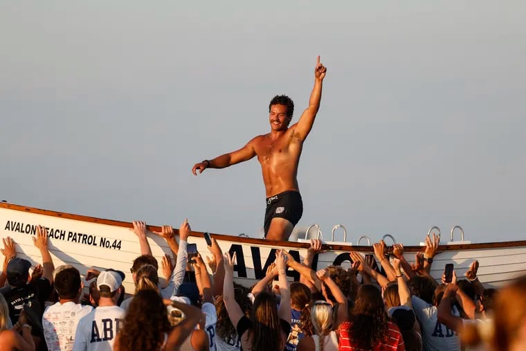 Avalon Beach Patrol's Ryan Finnegan celebrates winning the South Jersey Lifeguard championship in Brigantine New Jersey. Monday, August 12, 2024.