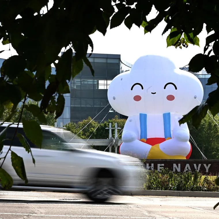 A 35-foot inflatable named "Seated Little Cloud"  is positioned at the South Broad Street entrance to the Navy Yard. The installation was created by LA-based artists Samuel Borkson and Arturo Sandoval III. Its placement is a part of Navy Yard's annual public art installation, which is curated by Philly collective Group X.