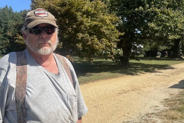 William 'Phil" Reuter, whose family has lived on and farmed land behind him in Harrison Township since 1878, is concerned about the potential impact of a proposed warehouse development there.