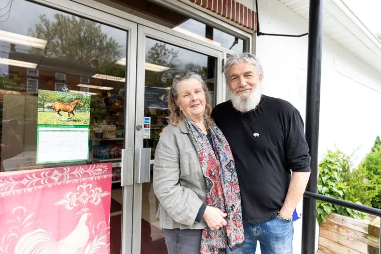 Anna Magazzeni, of Perkiomenville, Pa., Former Owner of Pughtown Agway, (left), and her husband Aldo Magazzeni, in front of the Agway entrance in Spring City, Pa., on Wednesday, May, 16, 2024.