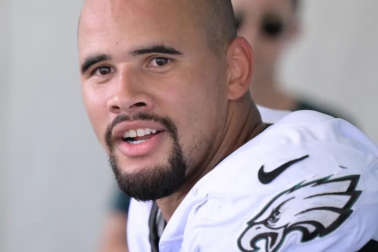 Eagles linebacker Zack Baun speaking with reporters Monday at training camp. He spent his first four NFL seasons with the Saints.