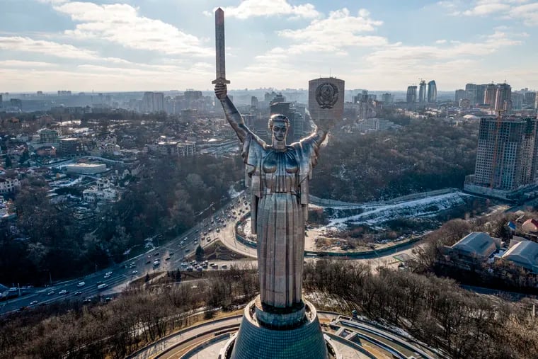 A view of Ukraine's the Motherland Monument in Kyiv Sunday, Feb. 13, 2022. U.S. pension boards are debating how they should respond to the Russian invasion of Ukraine. Should they sell their Russian investments and take big losses or wait for a recovery and then divest? (AP Photo/Efrem Lukatsky, File)