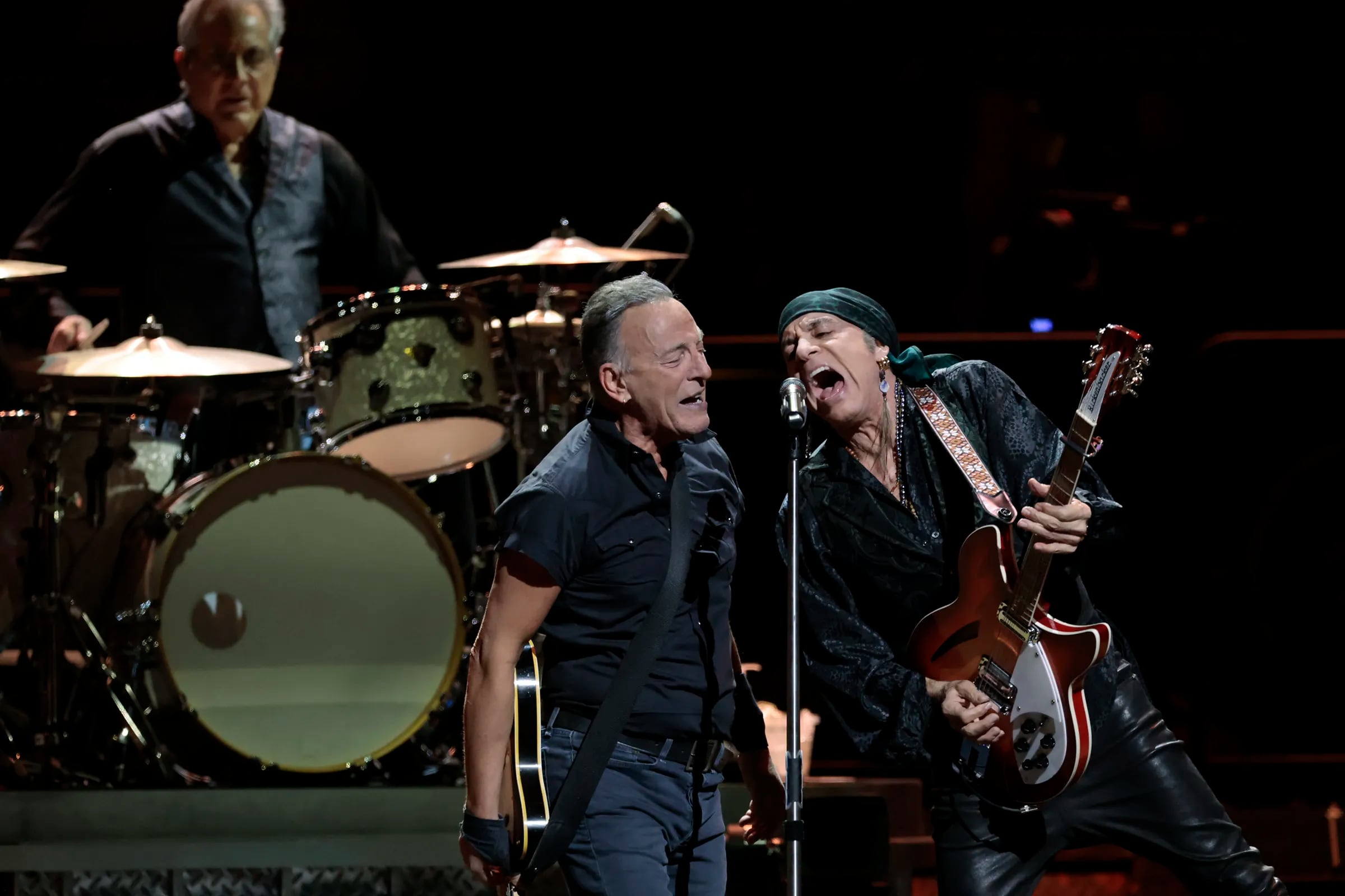 Bruce Springsteen performs with Steven Van Zandt (right) and drummer Max Weinberg (left) during the Bruce Springsteen and The E Street Band 2023 tour stop at the Wells Fargo Center on March 16, 2023.