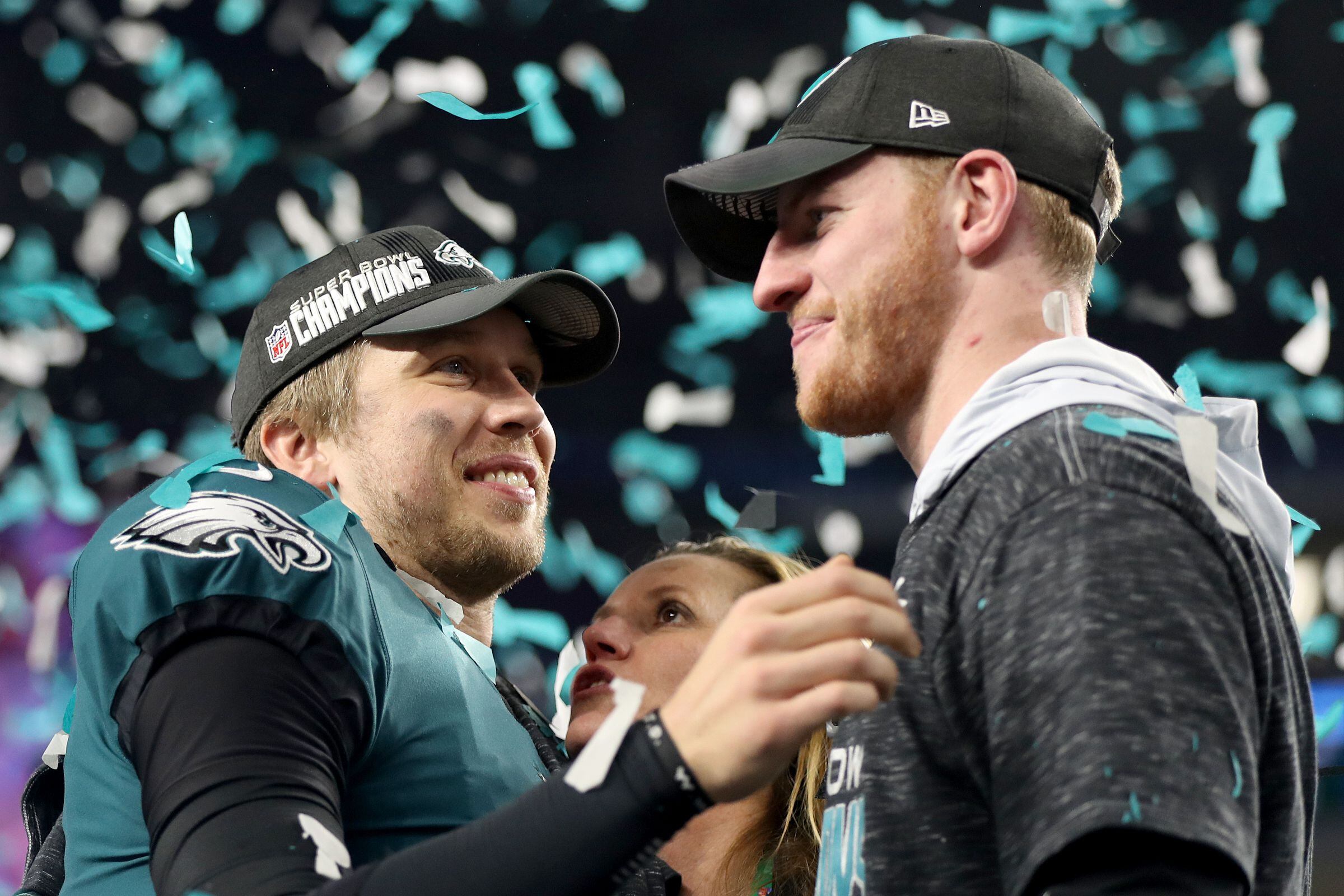 Eagles Quarterback Nick Foles hoisting the Lombardi Trophy after