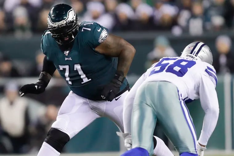 Eagles offensive tackle Jason Peters keeps an eye on Cowboys defensive end Robert Quinn during the Birds' 17-9 win Sunday.