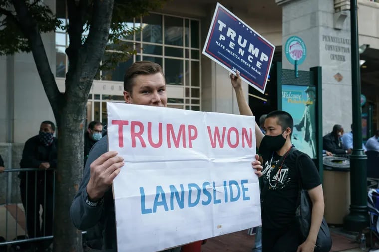 A Donald Trump supporter outside of the Pennsylvania Convention Center, where votes were being tallied, in November 2020 after Joe Biden had won.