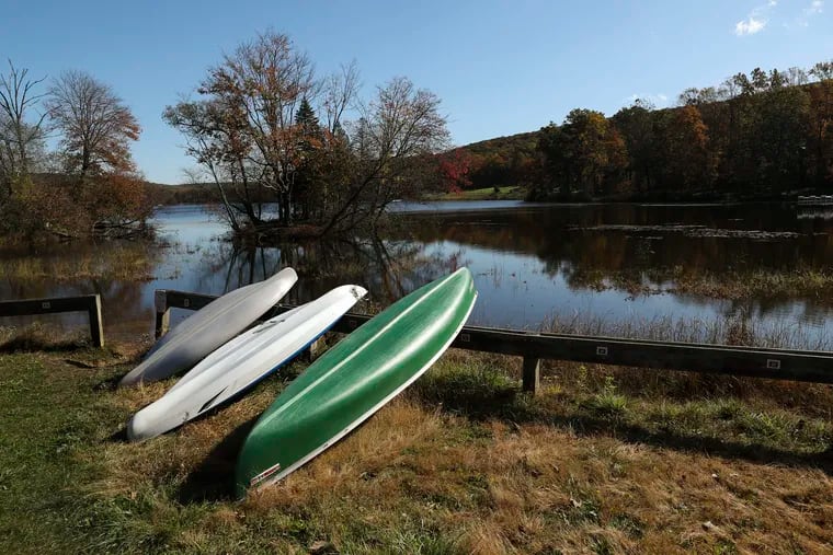 Boats are stored near Hopewell Lake at French Creek State Park in Elverson, Pa. on Wednesday, Oct. 23, 2019, during peak fall foliage time.
