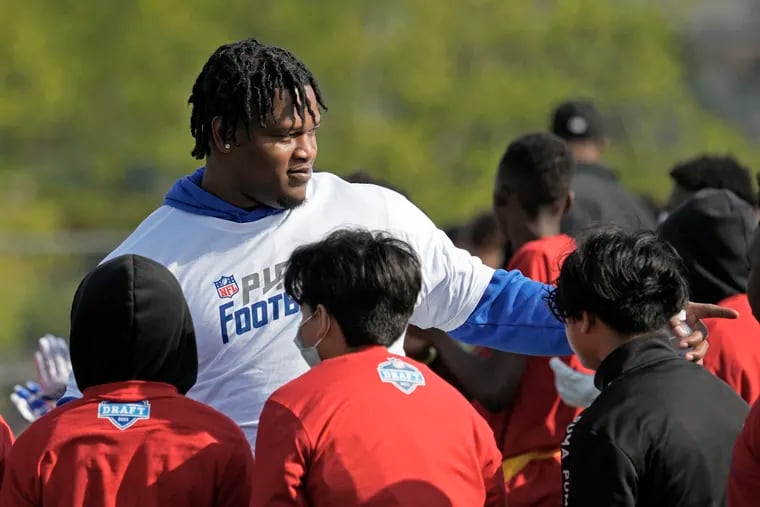 NFL draft prospect Jalen Carter takes part in a Play Football clinic ahead of the NFL draft Wednesday, April 26, 2023, at Center High School in Kansas City, Mo.