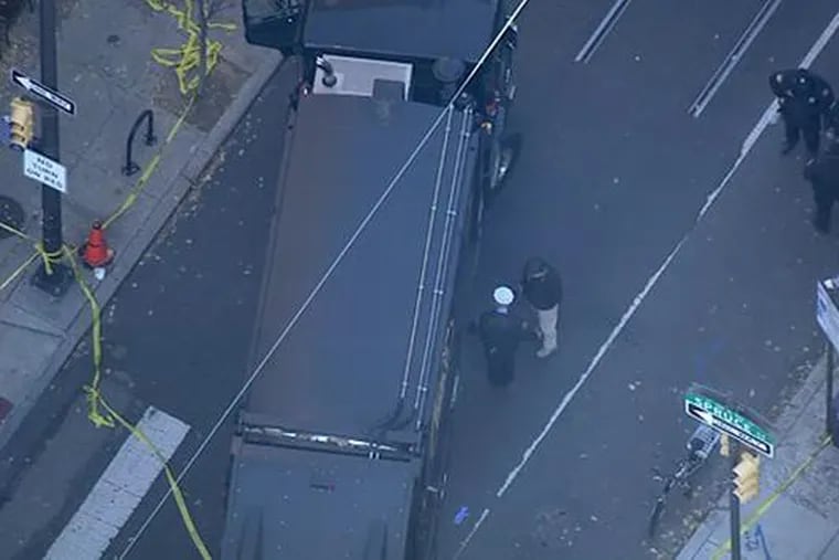 Overhead look at the scene of an accident at 11th and Spruce Streets on Tuesday. A female bicyclist was killed after being struck by a garbage truck.