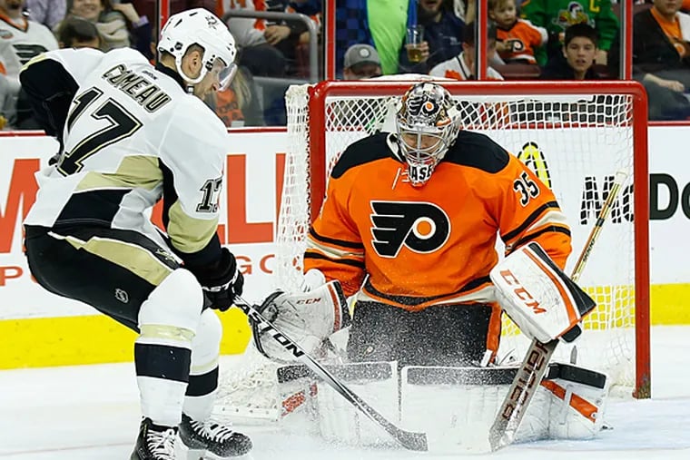 Steve Mason watches the Penguins' Blake Comeau with the puck. (Yong Kim/Staff Photographer)