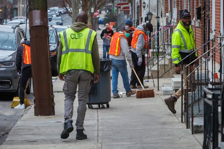City workers with the Community Life Improvement Program (CLIP) cleaning along Huntingdon Street near Kensington Avenue in Philadelphia, Friday, March 15, 2024.