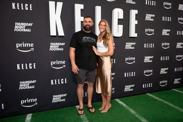 Jason Kelce (left) and his wife Kylie Kelce (right) pose for a photo together at the premier of Jason Kelce’s documentary at Suzanne Roberts Theater in Philadelphia on Friday, Sept. 9, 2023.