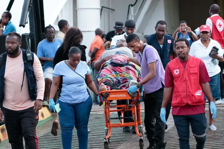 Members of the Red Cross transport a Union Island evacuee on a stretcher as she arrives in Kingstown, St. Vincent and the Grenadines, on Wednesday, July 3, 2024. The island, in the Grenadines archipelago, was hit by Hurricane Beryl.