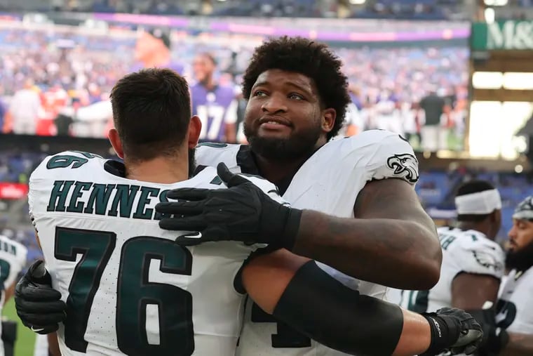 Eagles offensive tackle Fred Johnson (right) recently cracked the initial 53-man roster.