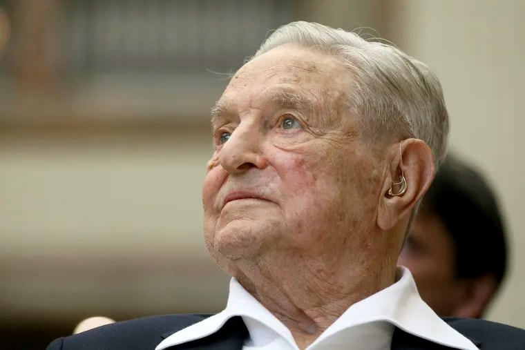 In this June 21, 2019 photo, George Soros, founder and chairman of the Open Society Foundations, looks on before the Joseph A. Schumpeter award ceremony in Vienna, Austria. Soros, the billionaire investor and philanthropist, has long been a target of conspiracy theories.