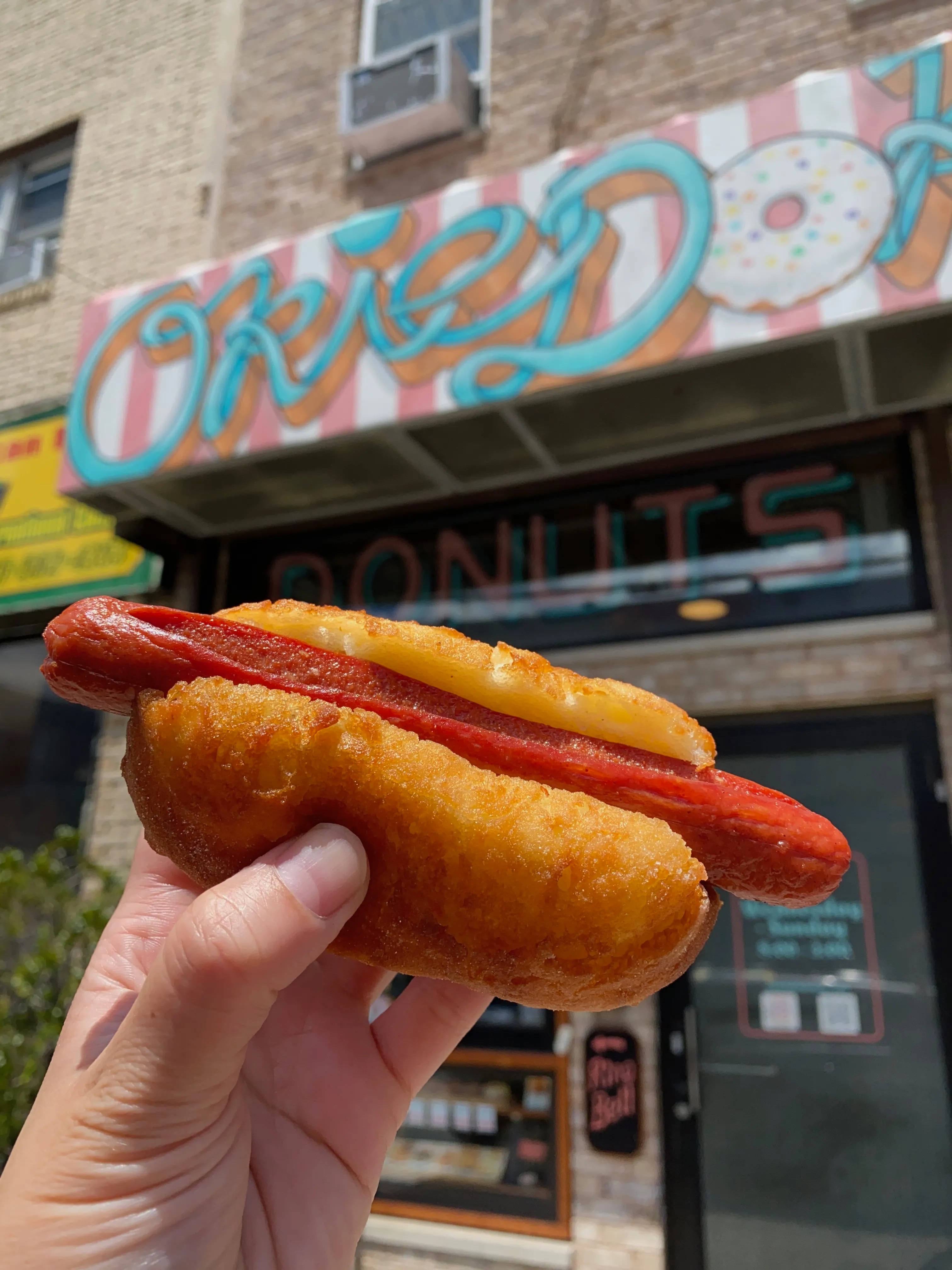 Okie Dokie Donuts' summer Hot Diggity Dog special: an all-beef Sabrett tucked into a toasted (gluten-free) doughnut bun. The dog is soy-, nut-, and peanut-free.