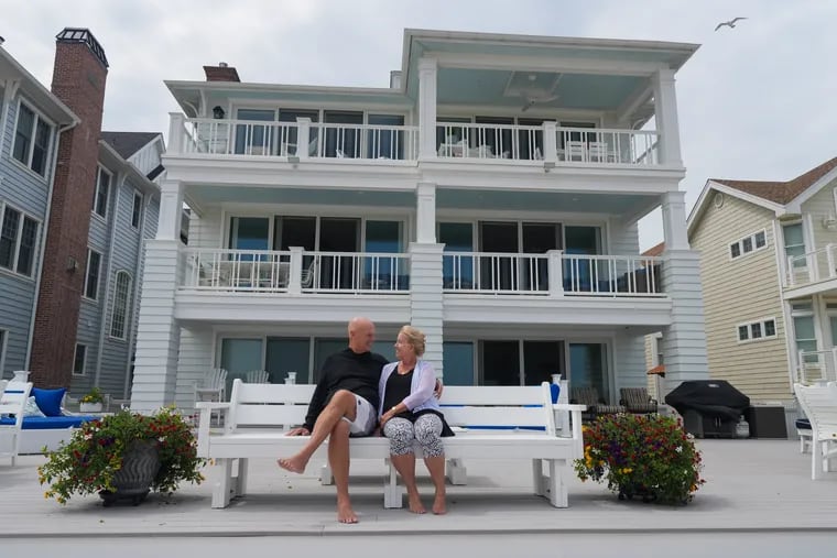 Chuck and Linda Ormsby sit on the patio of their Ocean City, N.J., oceanfront home on Friday, Aug. 9, 2024.