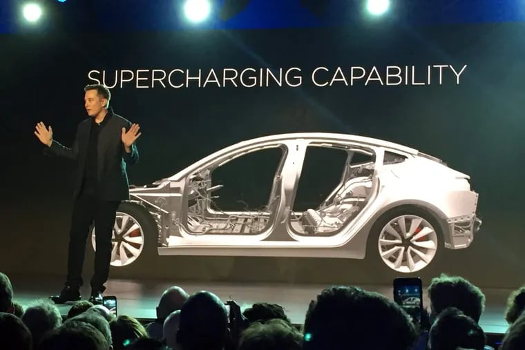 Tesla Motors Inc. CEO Elon Musk unveils the Model 3 at the Tesla Motors design studio in 2016.