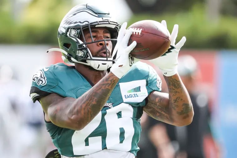 Eagles running back Miles Sanders catches the ball during a drill at training camp.