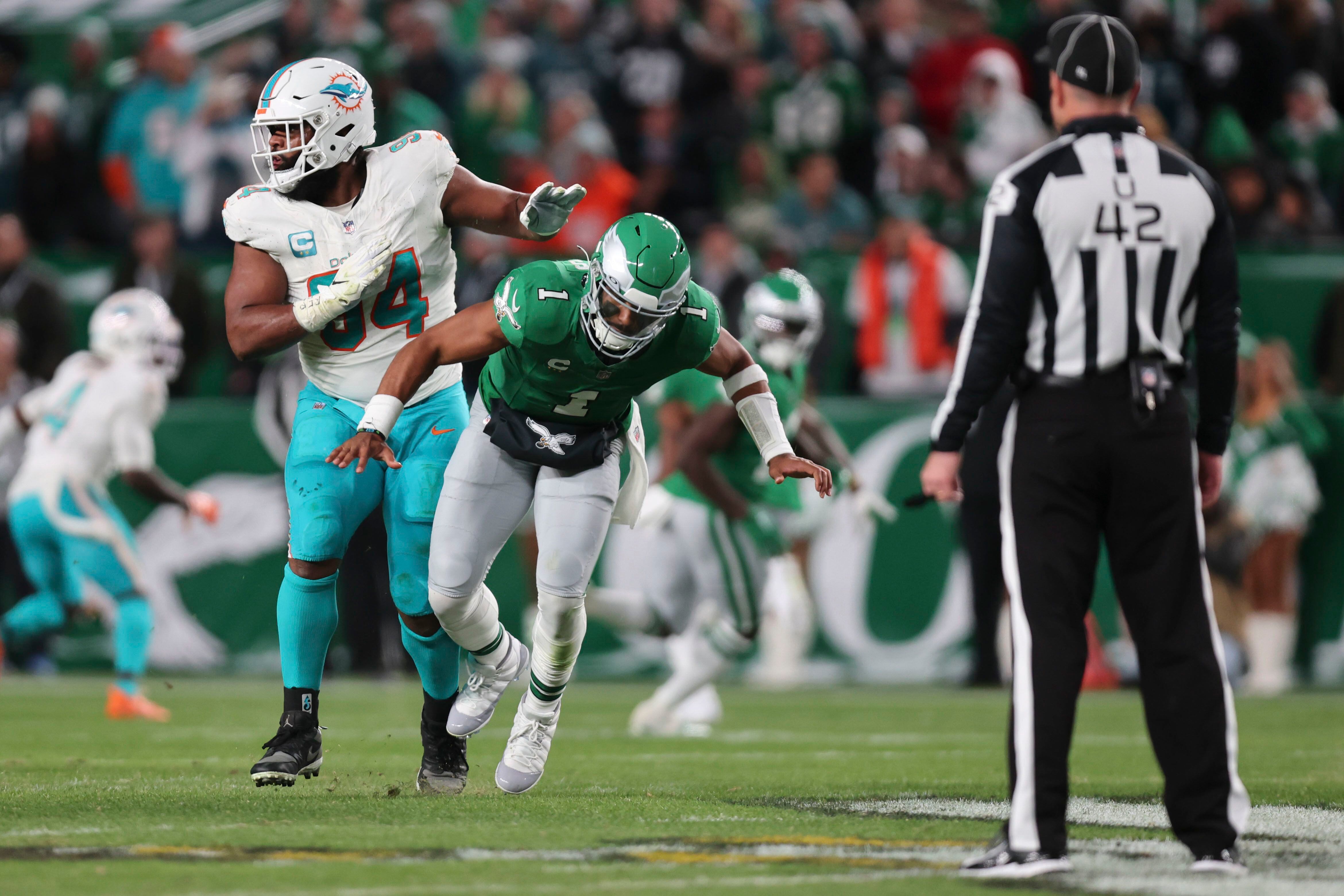 Hurts passes for 279 yards, throws a TD and runs for one in Eagles' 31-17  win over Dolphins