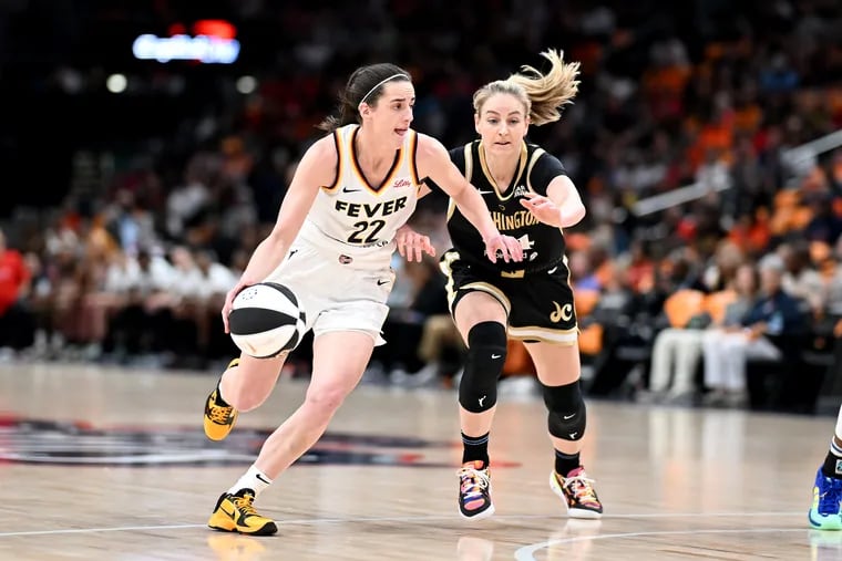 Caitlin Clark (left) reportedly won't make the U.S. Olympic women's basketball team.