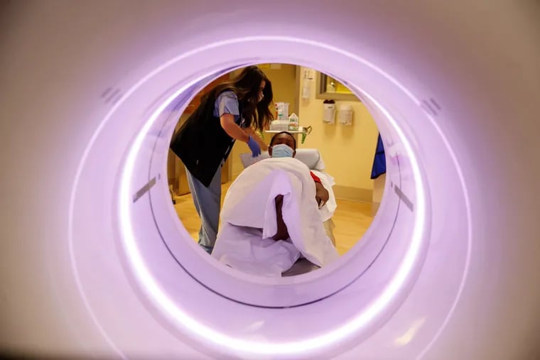 A patient is prepared for a CT scan at a hospital in Seattle. Independence Blue Cross and Penn Medicine recently started a pilot under which doctors with a history of few insurance denials for high-cost scans will not have to submit CT and other scans for preauthorization.