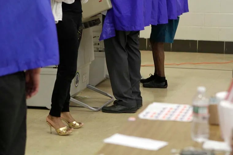 Voters in booths at Thomas G. Morton school on 2015 Primary Election Day in Philadelphia.
