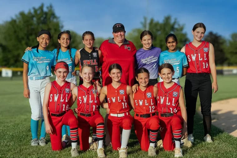 Coach Melanie Grubb (center) and the Swedesboro Woolwich Little League team will receive a $5,000 donation from Lance Sandwich Crackers to support future programs.