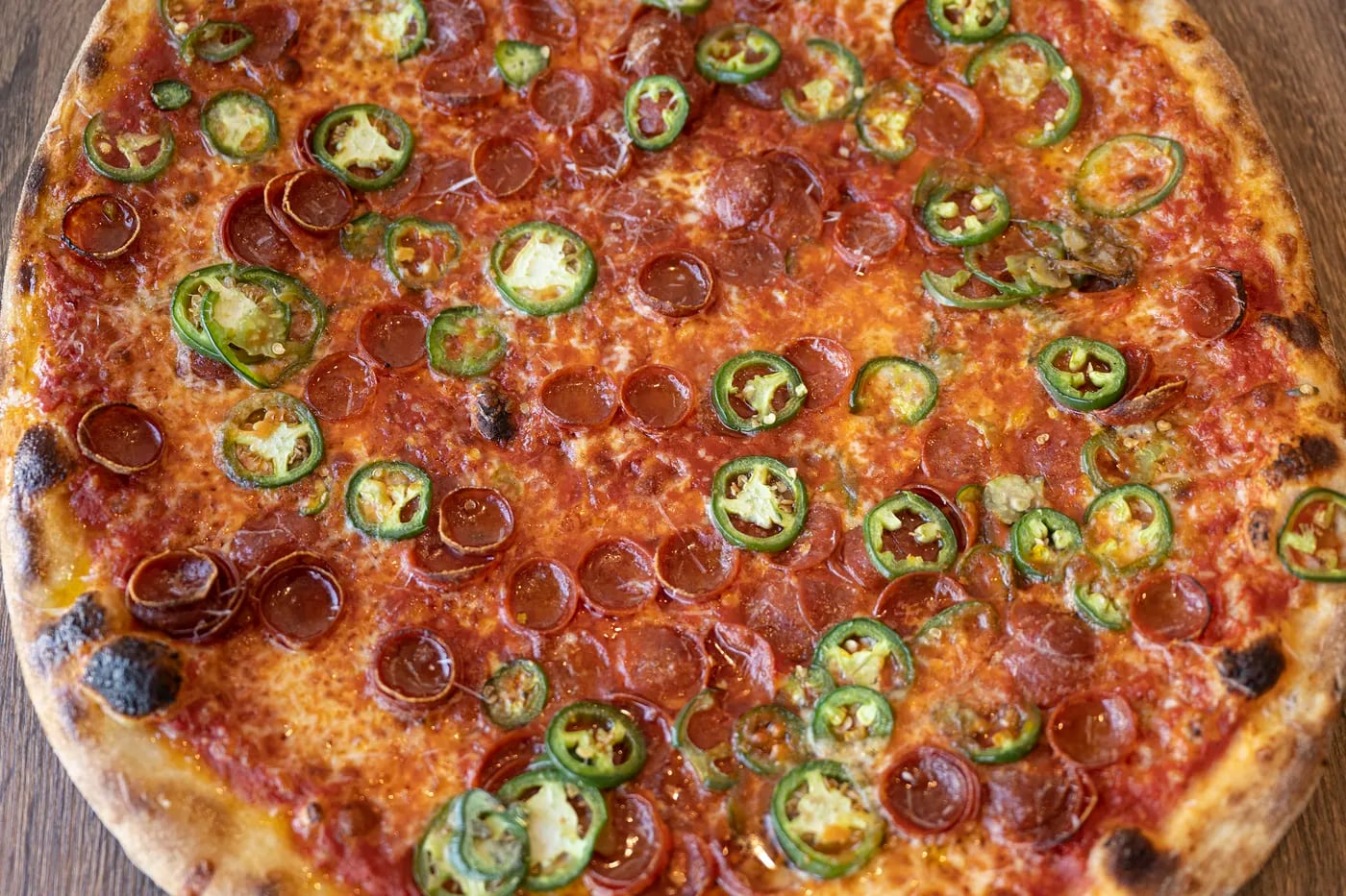 The Spicy ‘Roni blends cup and char pepperoni with fistfuls of shaved jalapeños at Bakeria 1010.