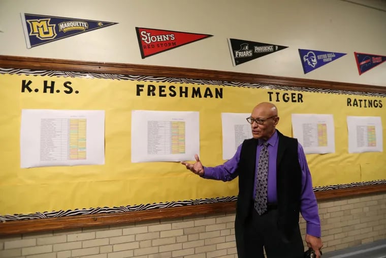 Principal Jose A. Lebron discusses the ninth grade progress wall at Kensington High School.