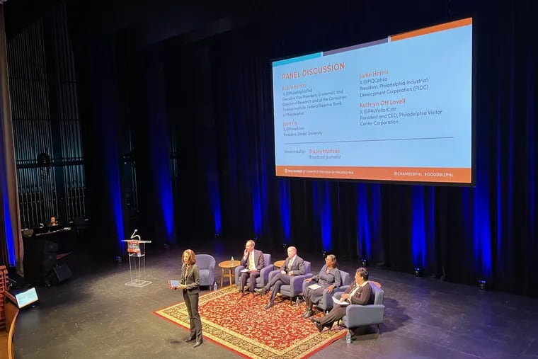 The Chamber of Commerce for Greater Philadelphia hosts its annual outlook event on Dec. 20, 2023, at the Kimmel Center for the Performing Arts in the Perelman Theater. Sitting on stage (from left) Roc Armenter, executive vice president, economist, and director of research of the Consumer Finance Institute, Federal Reserve Bank of Philadelphia; John Fry, president, Drexel University; Jodie Harris, president, PIDC; Kathryn Ott Lovell, president and CEO, Philadelphia Visitor Center Corp. Standing is moderator Tracey Matisak.