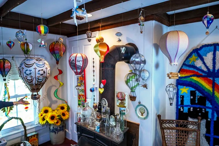 Barbara Kotzin decorated an upstairs room with dozens of miniature hot air balloons suspended from the ceiling. Hot air balloons became popular in the 1800s, in keeping with the theme of her Victorian home.