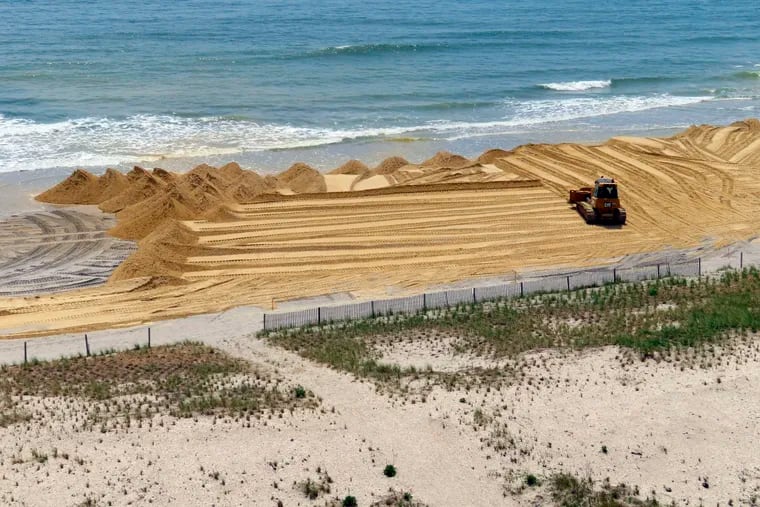 File: A bulldozer spreading sand on the beach in front of the Ocean Casino Resort in Atlantic City, N.J., Friday, May 12, 2023. The casino spent $700,000 of its own money to rebuild the eroded beach. A new study published in March, 2024 in the journal Nature, calls Atlantic City one of the "disappearing" cities along U.S. coasts because of sea level rise.