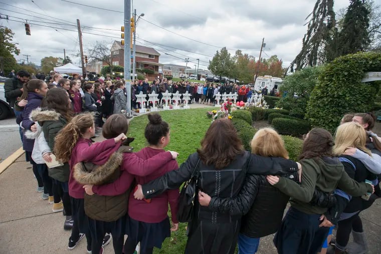 Girls from the Yeshiva School of Pittsburgh gather to sing and pray at the memorial outside of the Tree of Life Synagogue in Pittsburgh on Oct. 29, 2018.