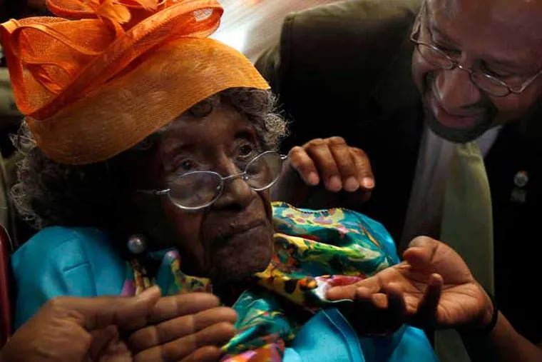 Mayor Nutter greets Anna Henderson, who's 58 years his senior, yesterday at an event in City Hall honoring Philadelphia's oldest citizens. At 113, Henderson is also the sixth-oldest American. (David Maialetti / Staff Photographer)